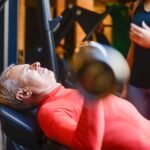 Man over 50 performing resistance training exercises to maintain muscle strength and prevent sarcopenia