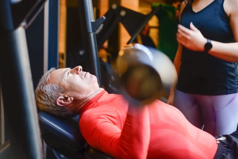 Man over 50 performing resistance training exercises to maintain muscle strength and prevent sarcopenia